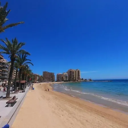 Lejlighed Espana - Punta Prima Orihuela Costa - Large For 6-people 85m2 And Terrace 40m2 Air Conditioning Wi-fi Living Kitchen 2 Bedrooms 2 Bathrooms 3 Swimming Pools Parking Security To The Sea 200m Only 40 Min To The Airport Torrevieja